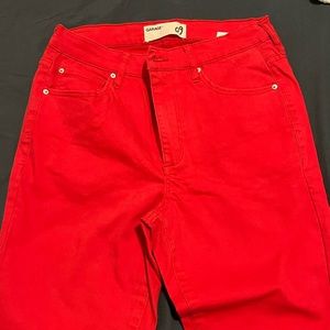 Red skinny jeans with frayed cuffs